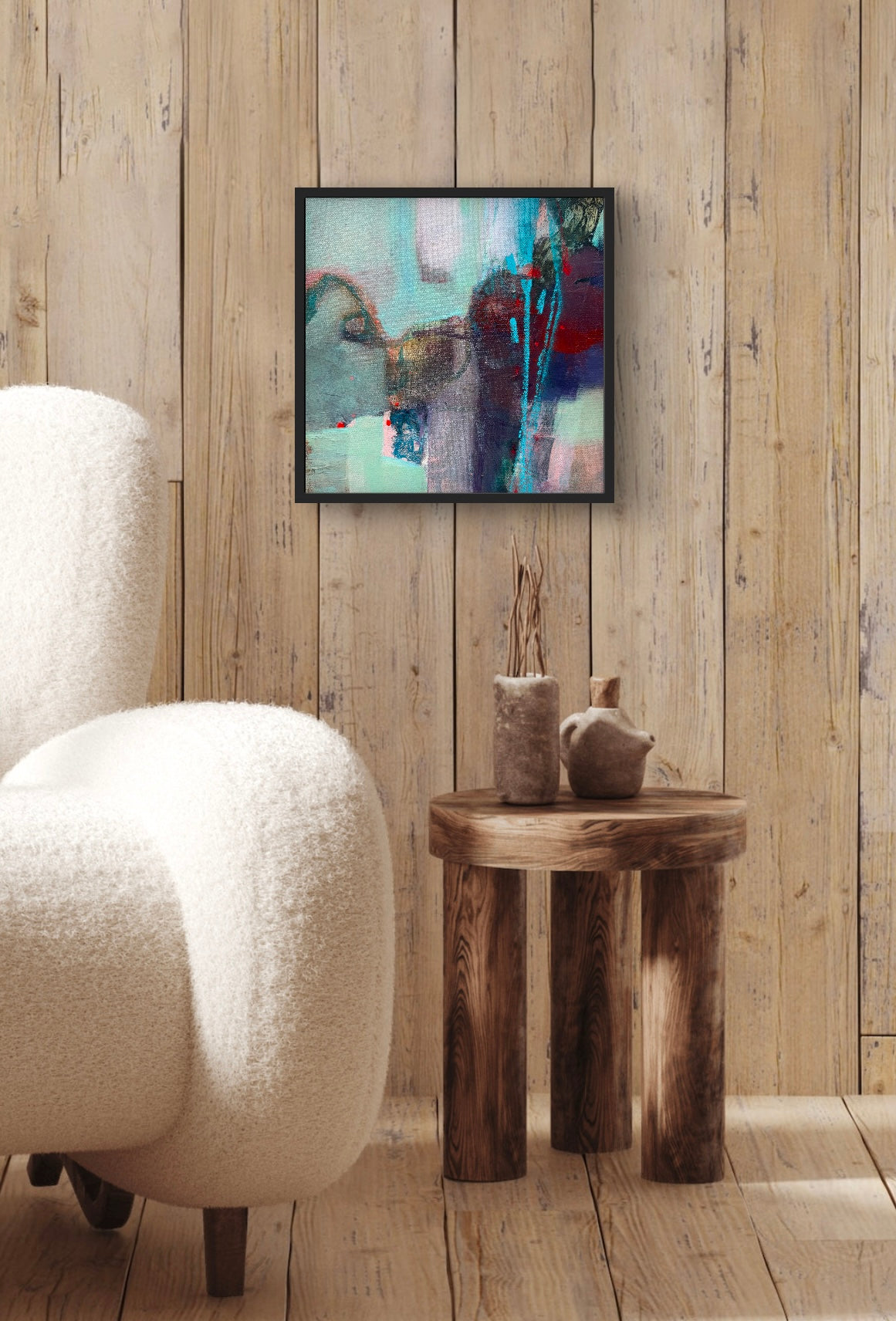 Demonstrates how the painting "Gypsy Soul" looks hanging on a wall above a chair and side table.
